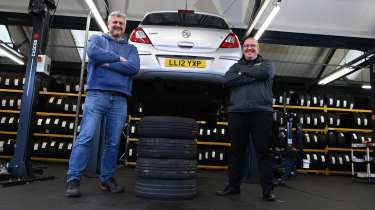 Auto Express consumer editor Chris Rosamond and Protyre area manager Simon Hall standing next to a vehicle inspection ramp
